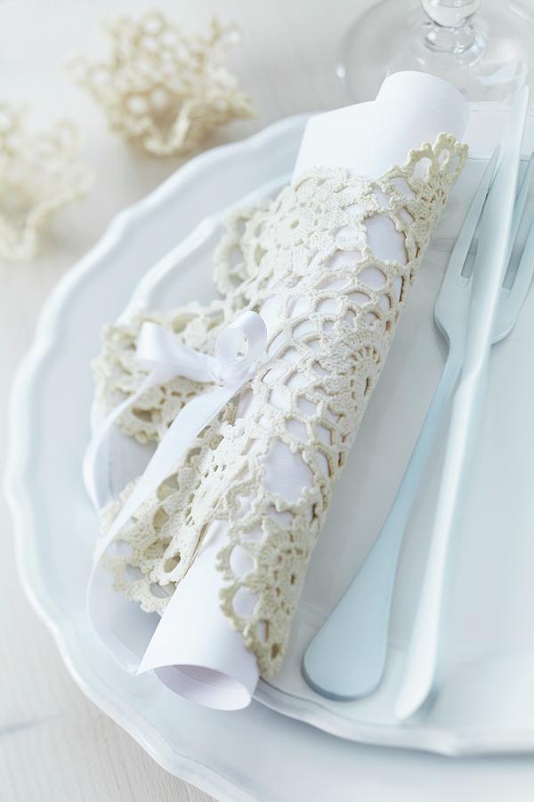 Menu Rolled Up In Crocheted Doily And Cutlery On Set Of Plates Photograph by Franziska Taube