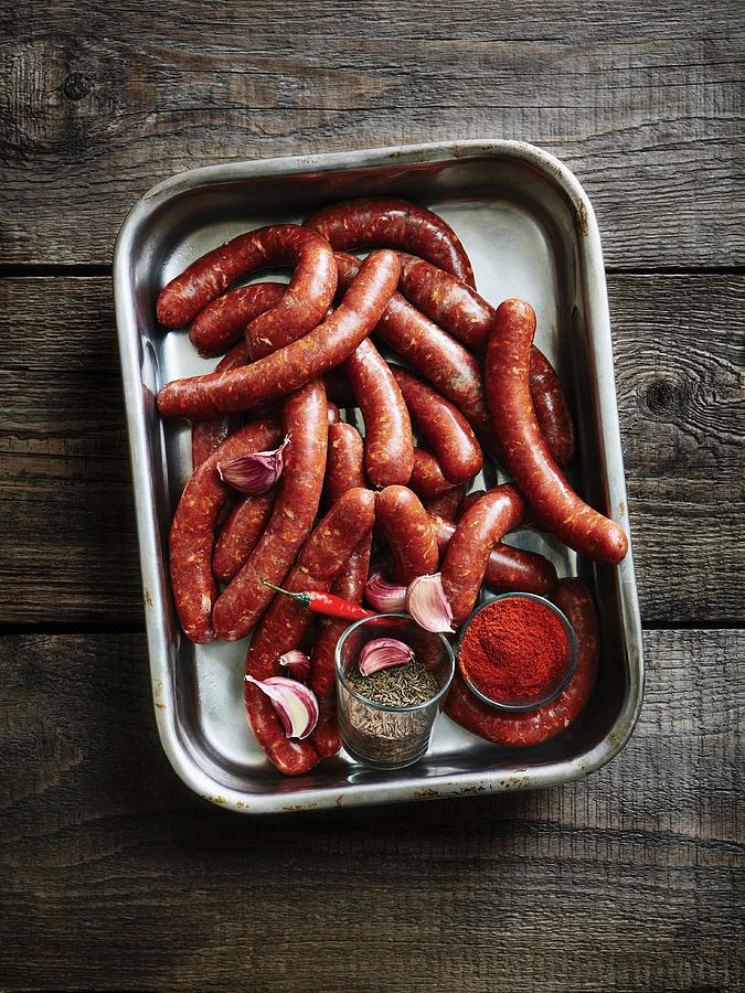 Merguez north African Sausages On A Baking Tray Photograph by Thorsten Kleine Holthaus