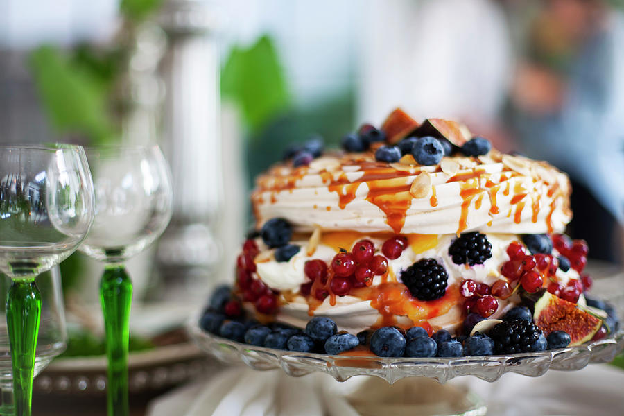 Meringue Cake With Autumnal Berries On A Cake Stand Photograph by Alicja Koll