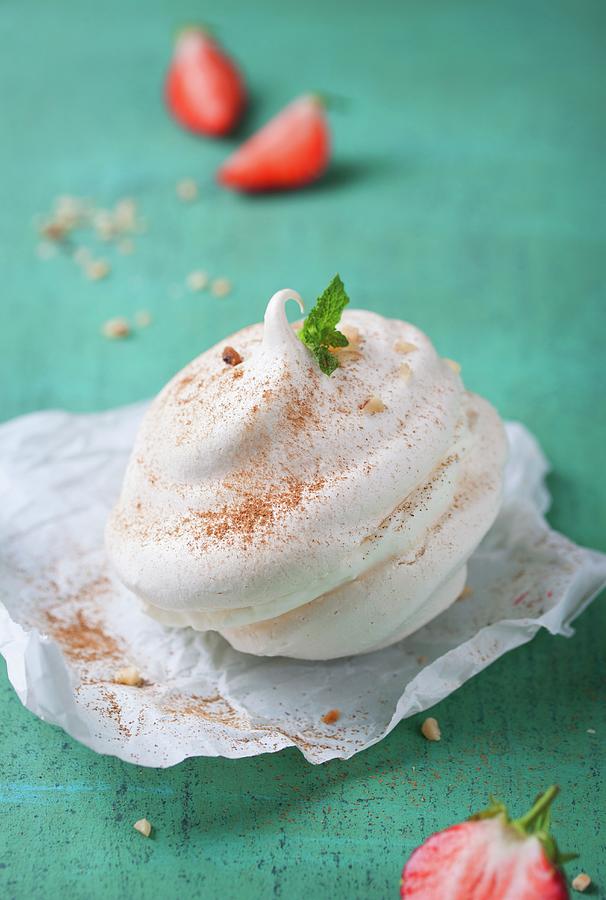 Meringue Dessert Filled With Cream And Sprinkled With Cinnamon Photograph by Valeria Aksakova