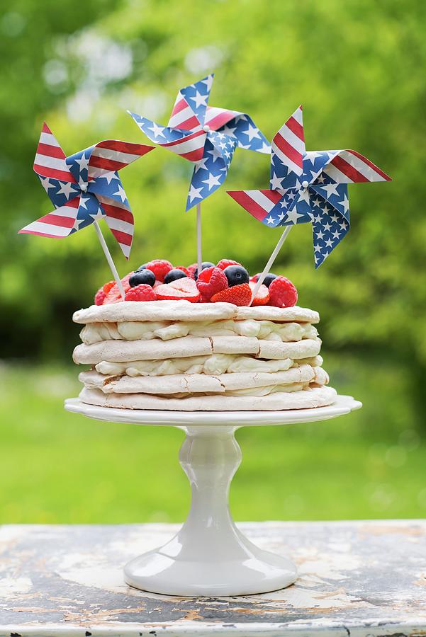Meringue Layer Cake With Berries And Usflag Pinwheels Photograph by