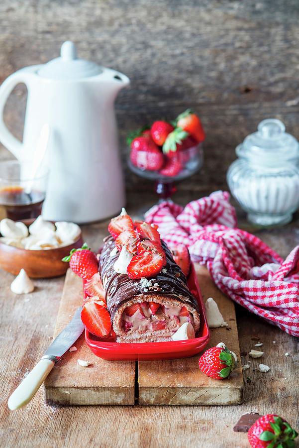 Meringue Roulade With Strawberries And A Chocolate Glaze Photograph by Irina Meliukh
