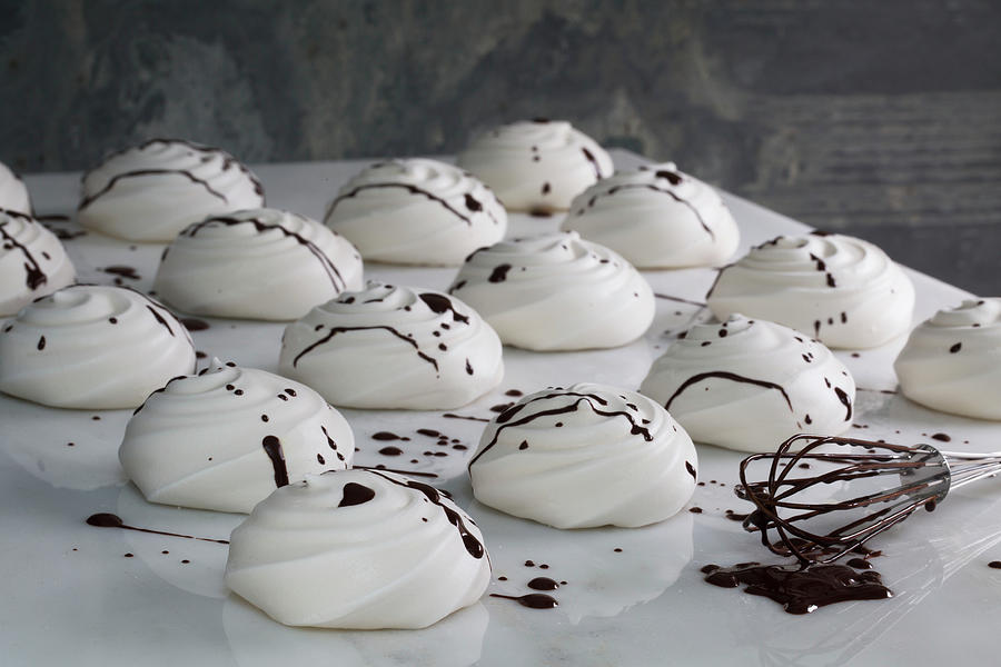 Meringues With Chocolate Sauce Photograph by Kathrin Mccrea