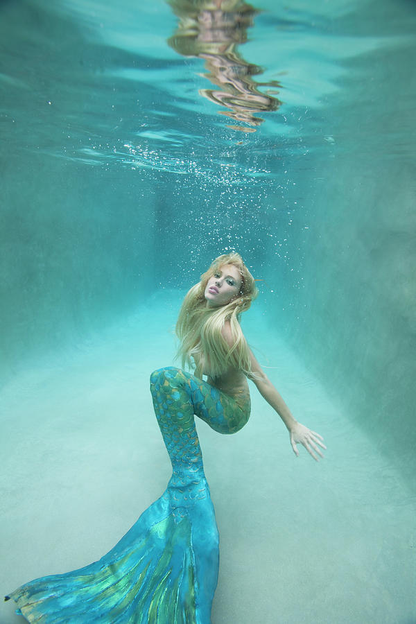 Mermaid Swimming Under Water by Ariel Skelley