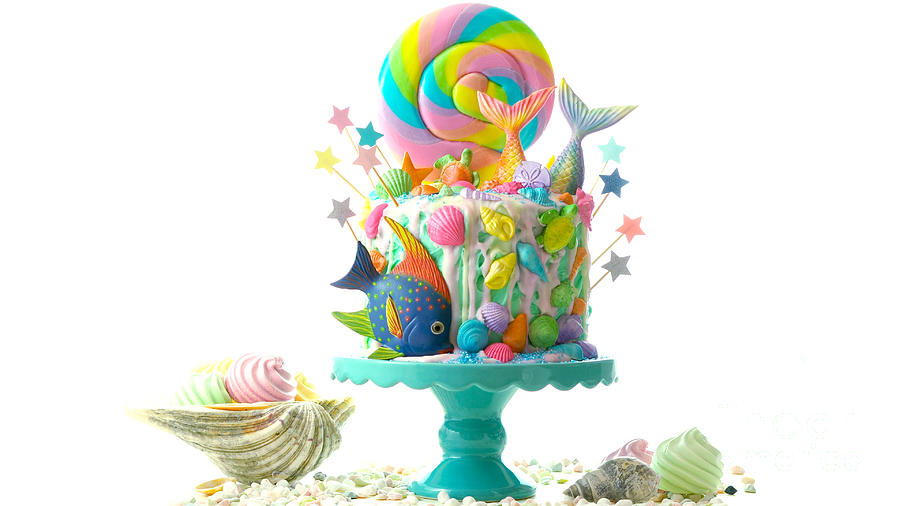 Mermaid theme candyland cake with glitter tails, shells and sea creatures. Photograph by Milleflore Images