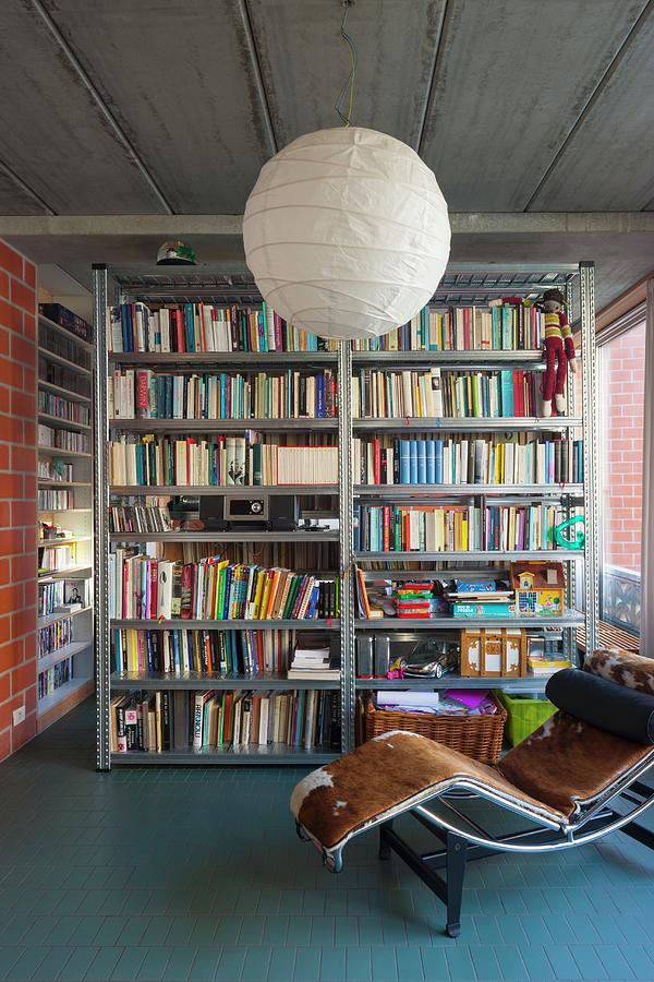 Metal Bookcases In Industrial Loft Apartment Photograph by Liesbet Goetschalckx