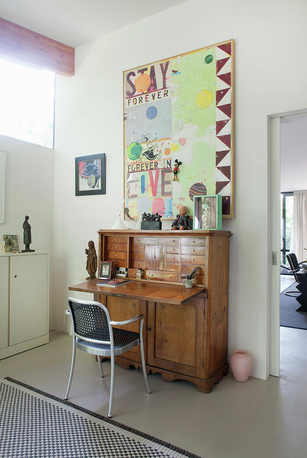 Metal Chair At Antque Bureau Below Modern Painting Photograph by Gonkel/stegeman