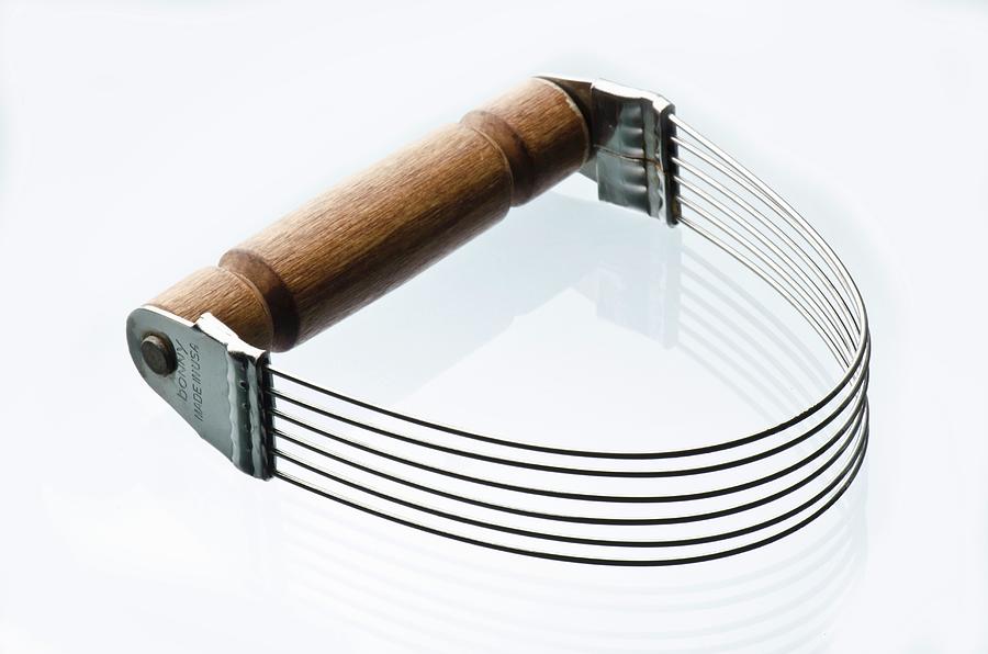 Metal Pastry Cutter With Wooden Handle On A White Background Photograph by Fred Hansen Photography