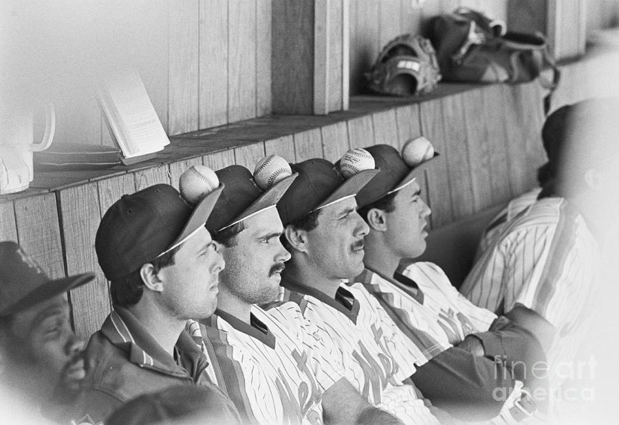 Mets Players Sitting With Baseballs Photograph by Bettmann