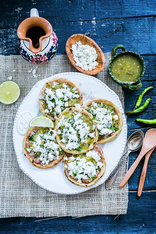 Mexican Corn Tarts With Beans, Queso-fresco fresh Cheese, Chopped Onions And Green Chilli Sauce Photograph by Maricruz Avalos Flores