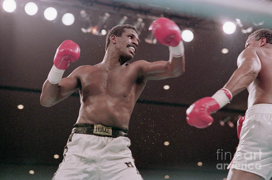 Michael Spinks Boxing Against Larry Photograph by Bettmann