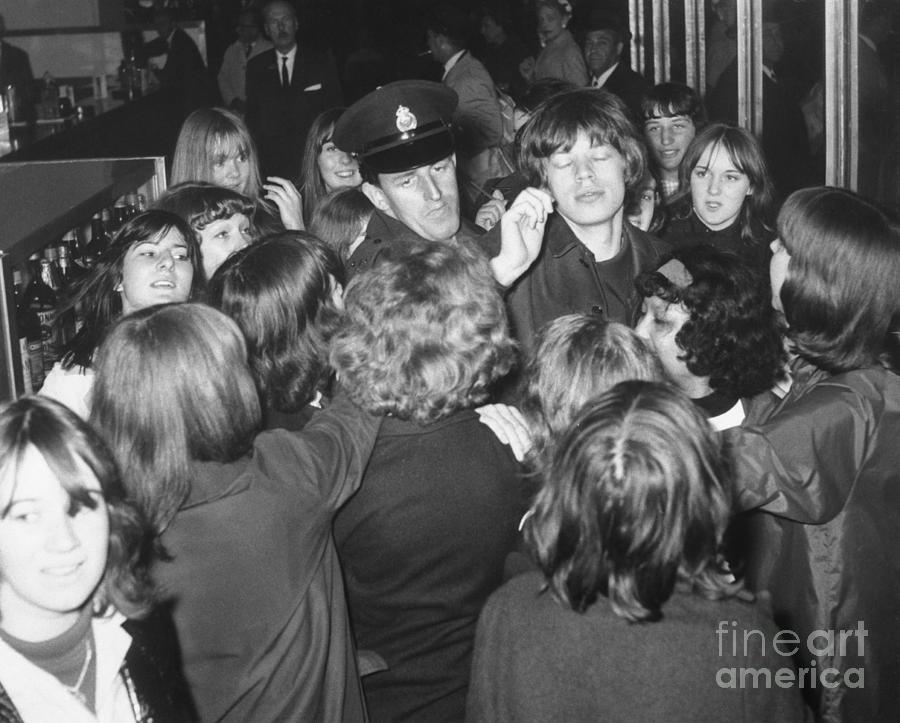 Mick Jagger Surrounded By Fans Photograph by Bettmann