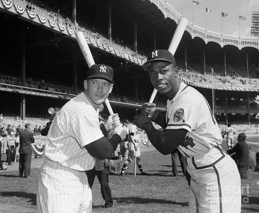 Mickey Mantle Photograph - Mickey Mantle And Hank Aaron Holding by Bettmann