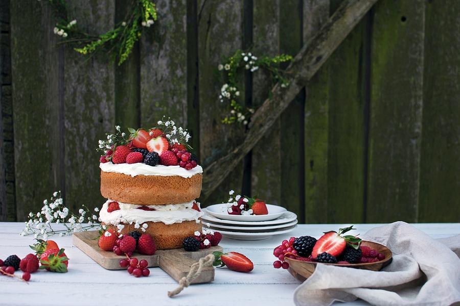 Midsummer Layer Cake With Whipped Cream And Berries Photograph by Justina Ramanauskiene