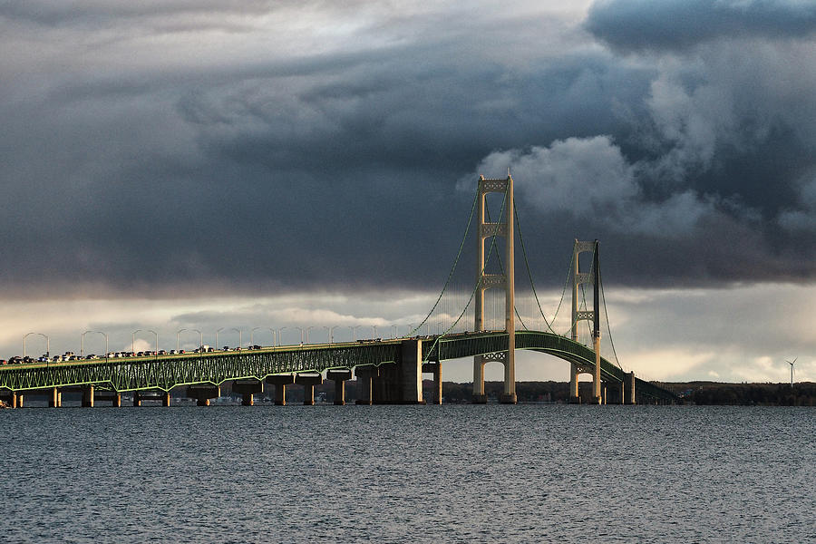 Mighty Mac over the Straits of Mackinac Photograph by Bill Swartwout