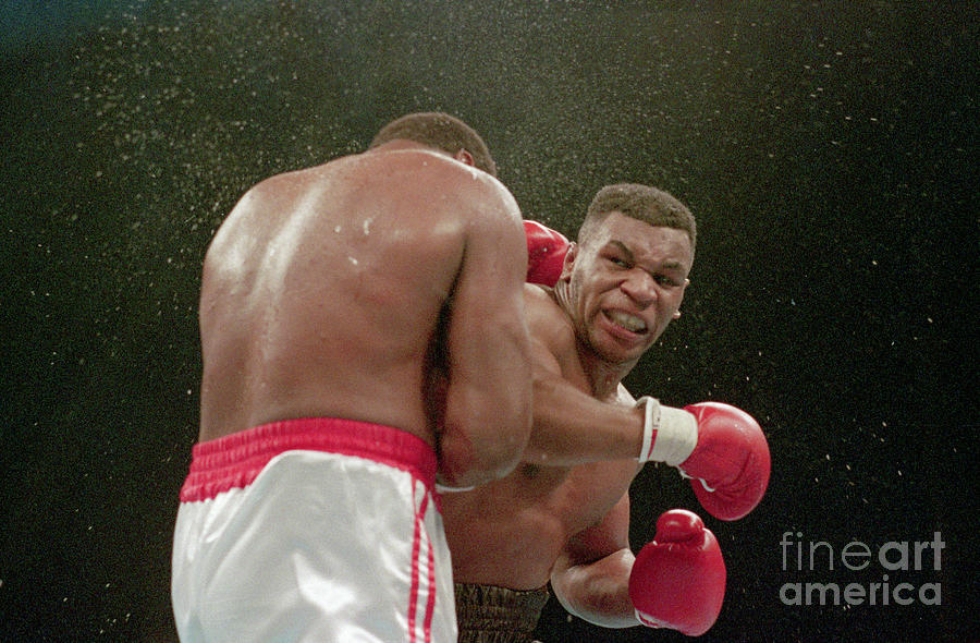 Mike Tyson Delivers Ko Punch To Larry Photograph by Bettmann