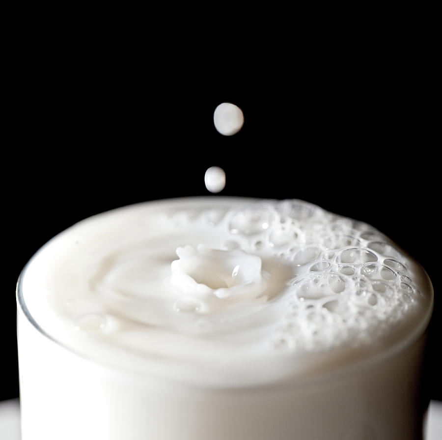 Milk Drops Falling In Glass Of Milk Photograph by Peter Chadwick Lrps