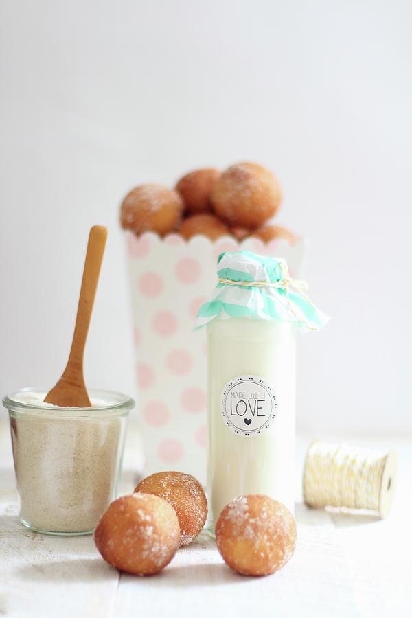 Milk In A Decorative Glass Bottle And Quark Doughballs With Cinnamon Sugar Photograph by Sylvia E.k Photography