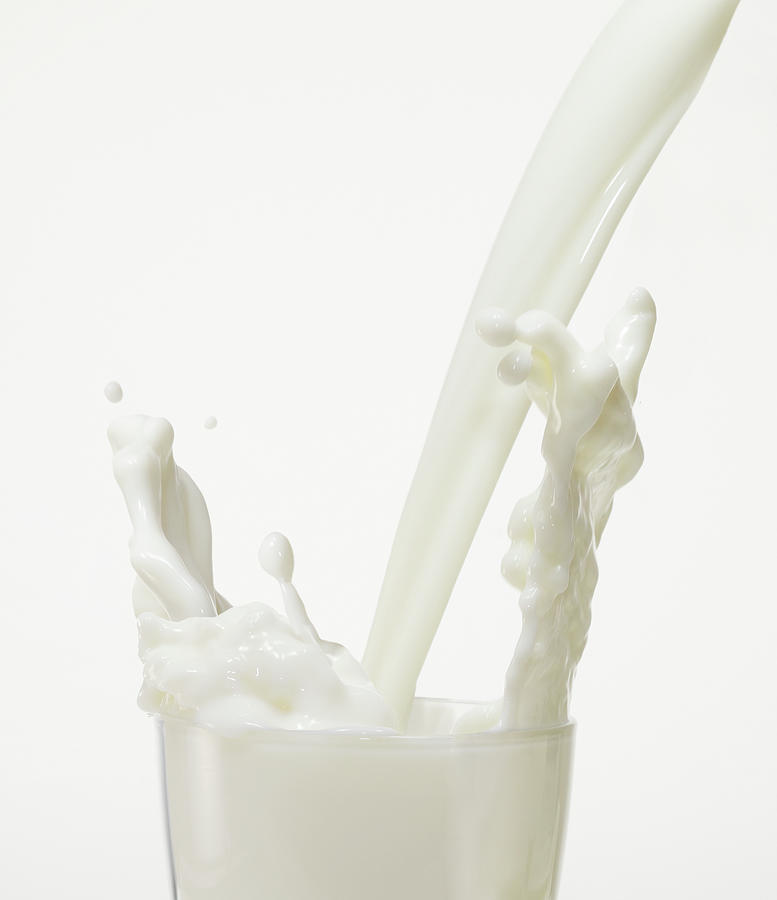 Milk Splash Photograph by Simon Battensby