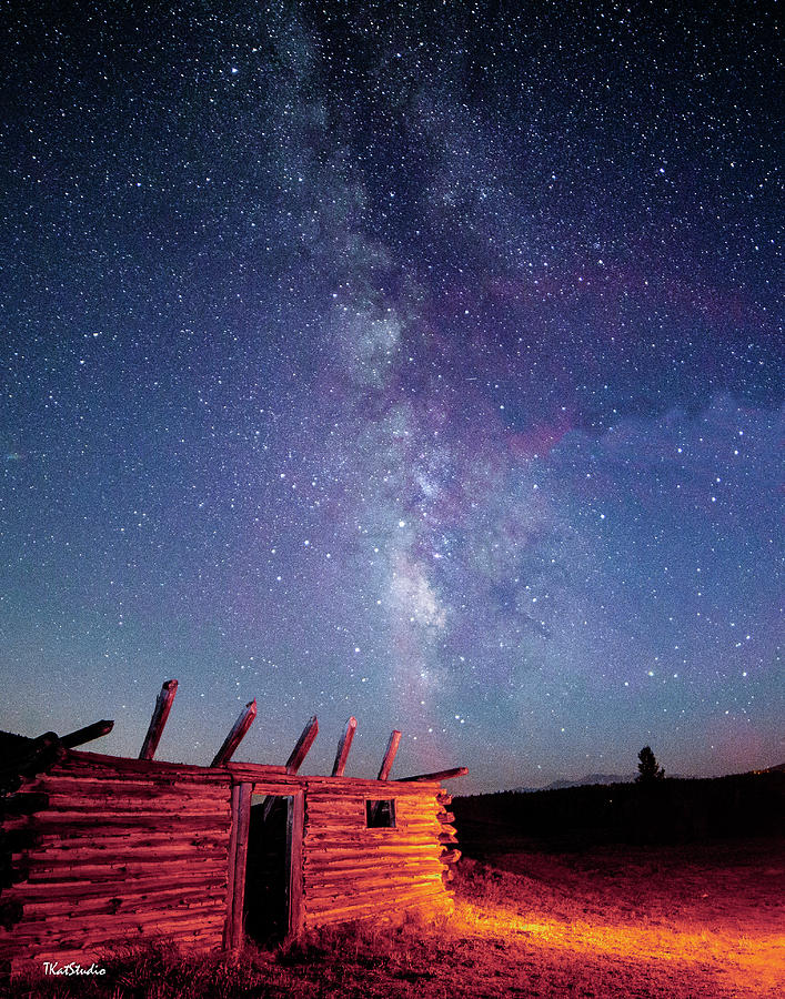 Milky Way Spilling Down on Cabin Photograph by Tim Kathka