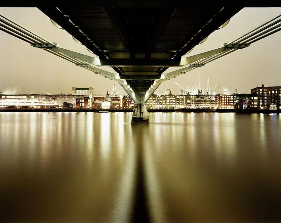 Millennium Bridge Reflected In The Photograph by Gary Yeowell