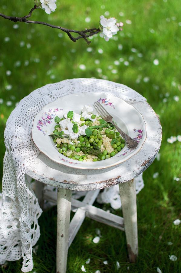 Millet Salad With Asparagus, Peas, Goats Cheese And Fresh Mint On An Old Garden Chair Photograph by Kachel Katarzyna