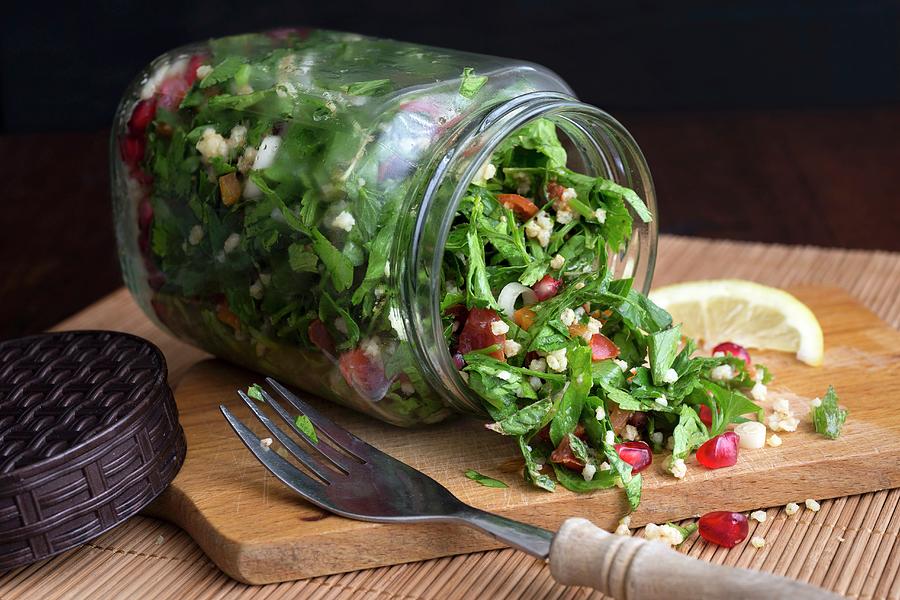 Millet Taboule In A Glass Jar With Pomegranate Seeds, Parsley And Mint Photograph by Etienne Voss