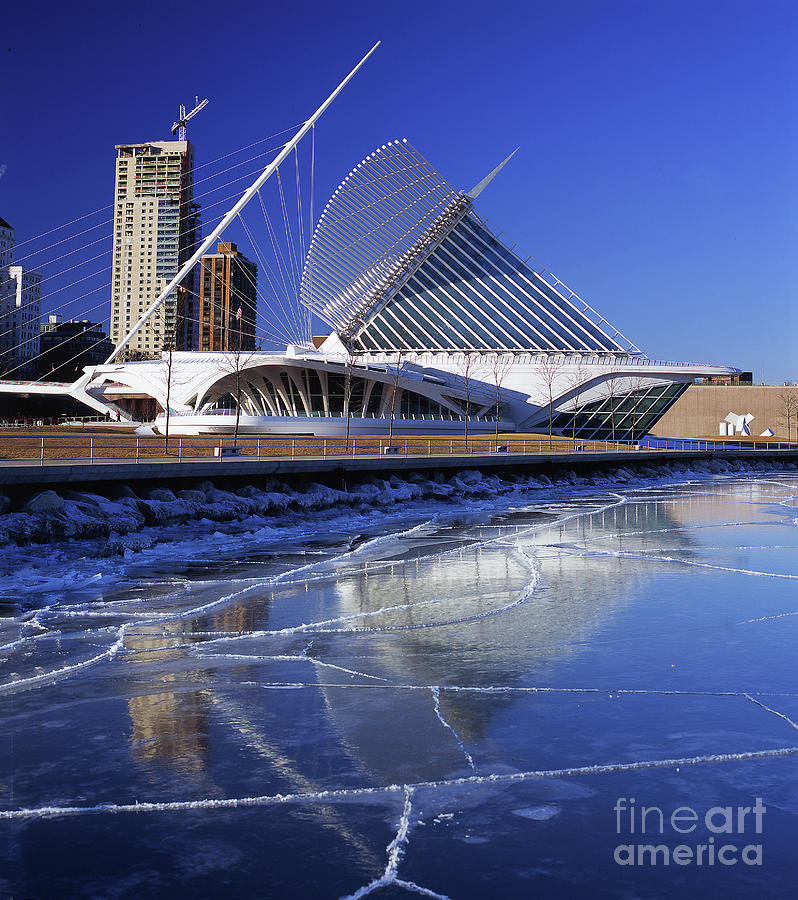 Milwaukee Art Museum Reflecting in Ice Floating on the Lake Photograph by Wernher Krutein