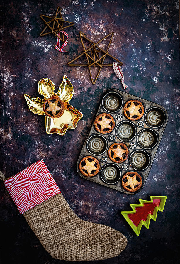Mince Pies In Baking Tray With Christas Decorations Photograph by Hein Van Tonder