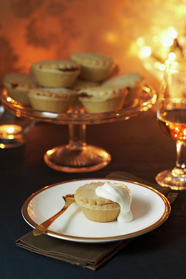 Mince Pies On A Cake Stand, With One On A Plate With Cream christmas Photograph by Charlotte Tolhurst