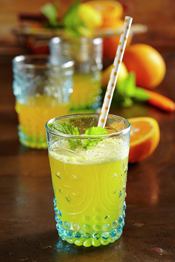 Mineral Water With Homemade Orange Syrup As A Refreshing Drink Photograph by Teubner Foodfoto