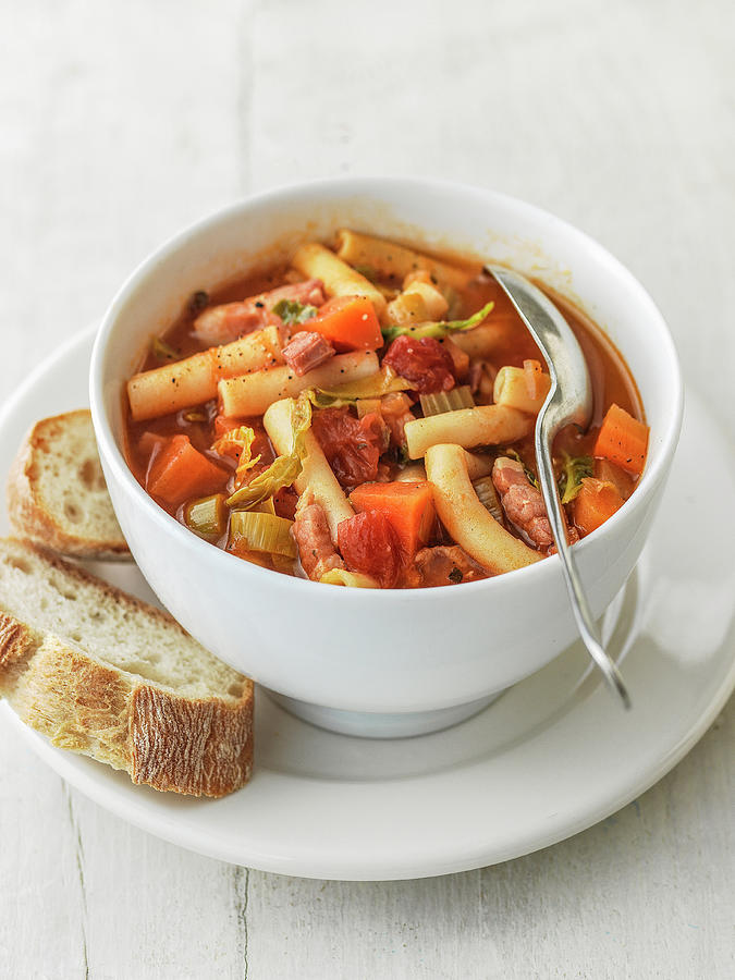 Minestrone Soup In Bowl With Celery, Tomatoes, Green Cabbage Pancetta Leeks And Maccaroni