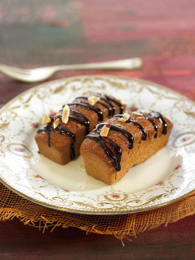 Mini Almond Cakes With Melted Chocolate Topping Photograph by Lawton