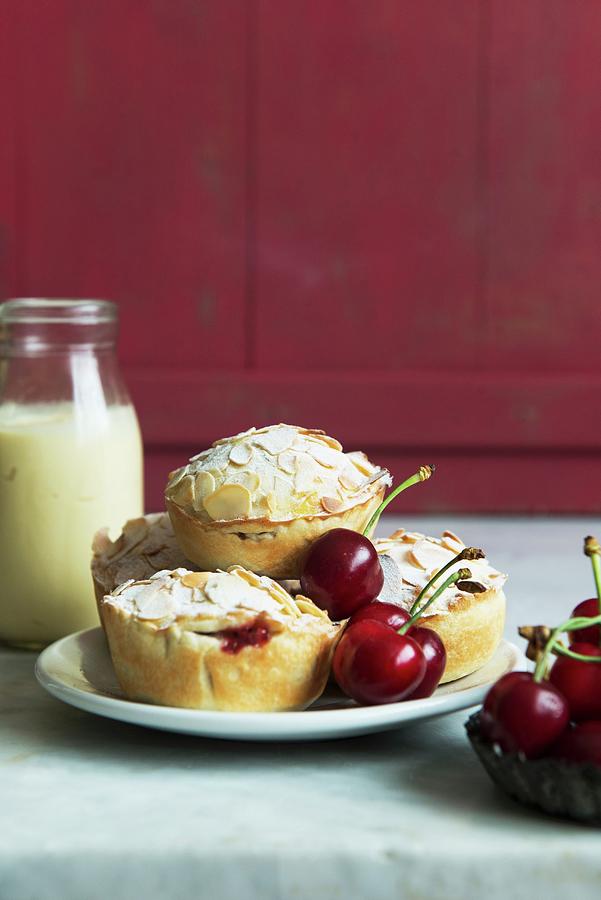 Mini Almond Pies With Cherry Filling Photograph by Studer, Veronika