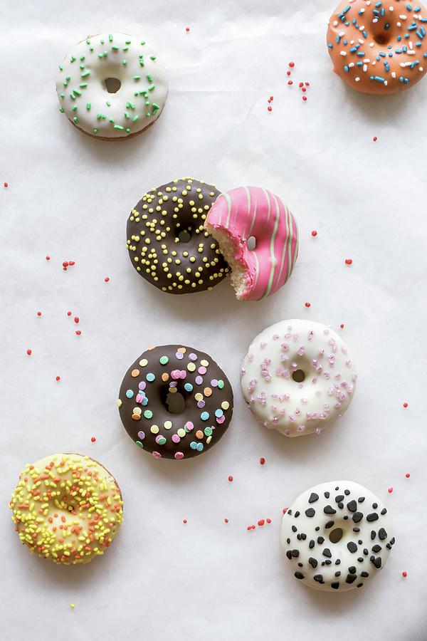 Mini American Donuts Splashed On The White Background Photograph by Ltummy