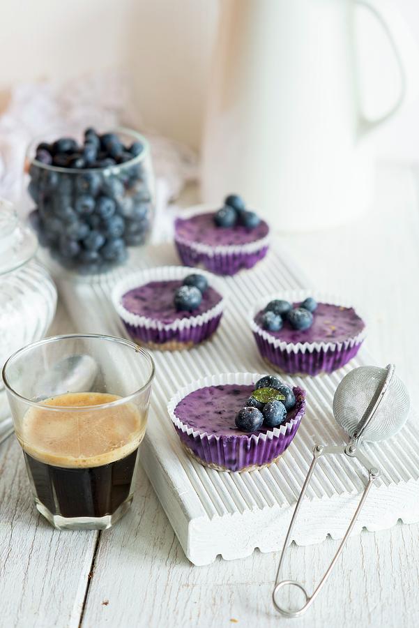 Mini Blueberry Cheesecakes On A White Chopping Board Photograph by Irina Meliukh