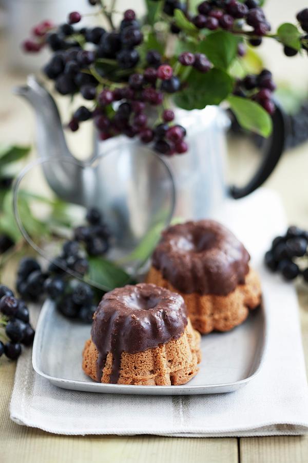 Mini Bundt Cakes With Rum Berries And Chocolate Glaze Photograph by Schindler, Martina