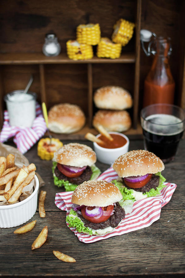 Beer Photograph - Mini Burgers beef Served With French Fries, Grilled Corn, Homenade Ketchup And Dark Beer by Kachel Katarzyna