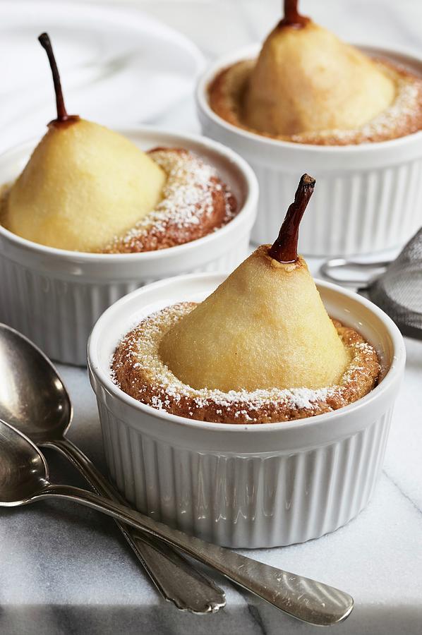 Mini Cakes With Poached Pears In Ramekins Photograph by Ulrike Emmert