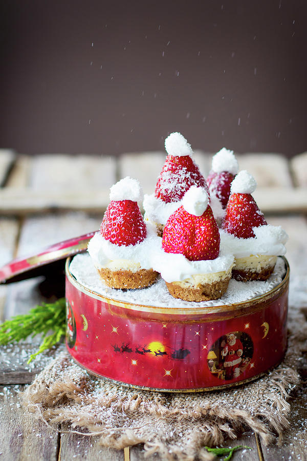Mini Cheesecake With santa Strawberry Hats On A Tin Photograph by Lana Konat