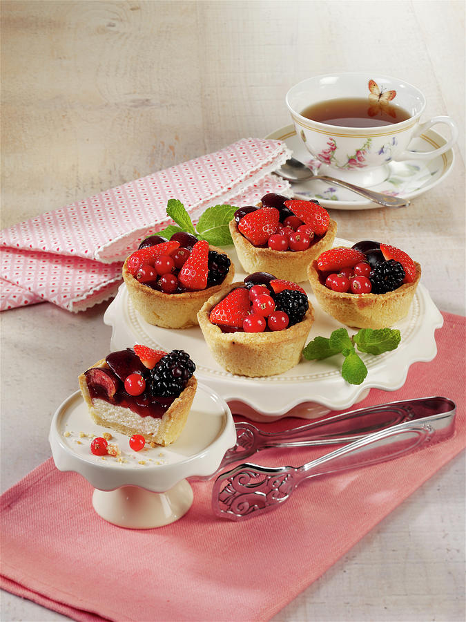 Mini Cheesecakes With Berries Photograph by Stockfood Studios / Photoart