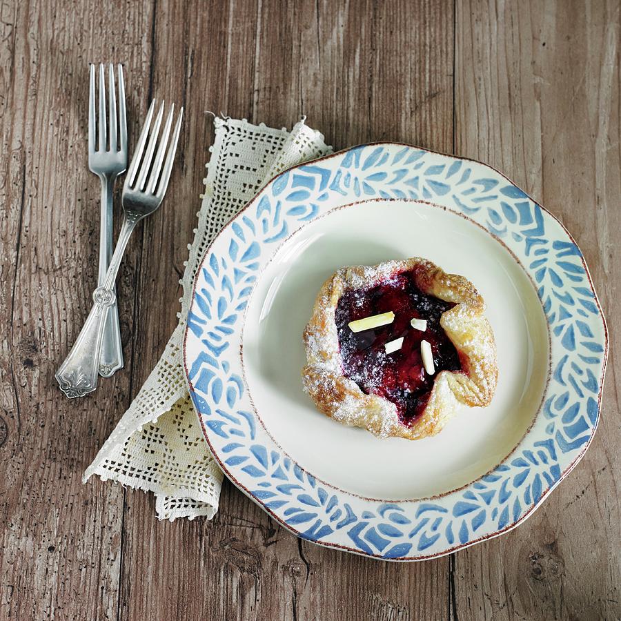Mini Cherry Crostata With Slivered Almonds And Icing Sugar Photograph by Allison Dinner