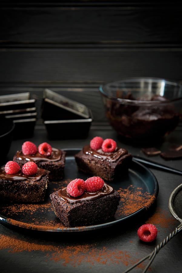 Mini Chocolate Cakes With Raspberries And Cocoa Powder Photograph by Magdalena Hendey
