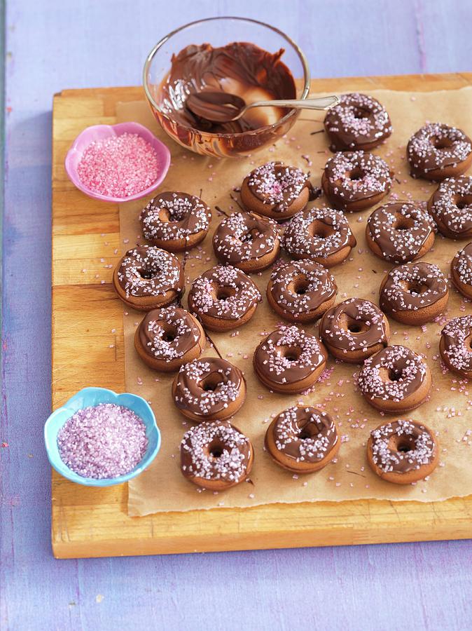 Mini Chocolate Doughnuts With Pink Sugar Photograph by Rua Castilho