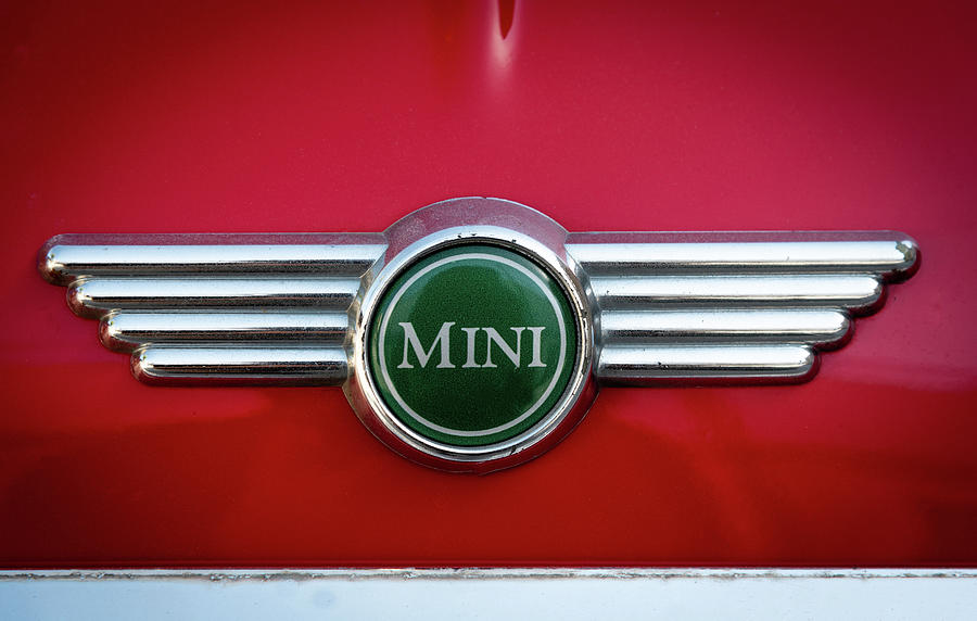 Mini Cooper car logo on red surface Photograph by Michalakis Ppalis