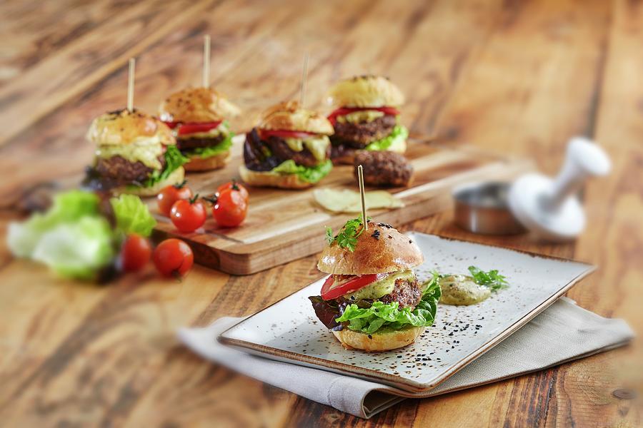 Mini Hamburgers With Lettuce, Tomatoes And Cheese Photograph by Niklas Thiemann