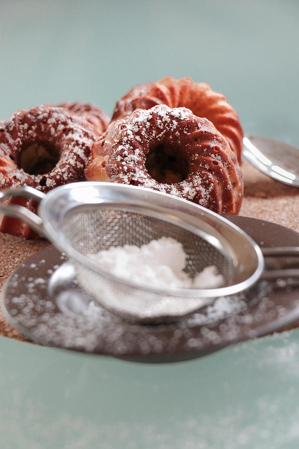 Mini Marble Bundt Cakes Dusted With Icing Sugar Photograph by Mara Wallinger