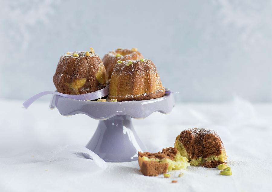 Mini Marbled Bundt Cakes With Chocolate And Pistachio Nuts Photograph by Sonia Chatelain