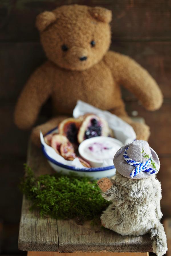 Mini Pancakes With Berries And Yoghurt Sauce In A Bowl Surrounded By Stuffed Animals Photograph by Susanne Schanz