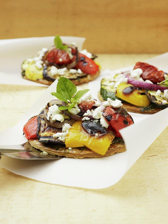 Mini Pizzas Topped With Ratatouille And Goats Cheese Photograph by Vincent Noguchi Photography